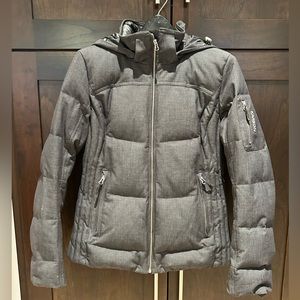 Premium high end women’s ski jacket. Heathered grey with black accents.